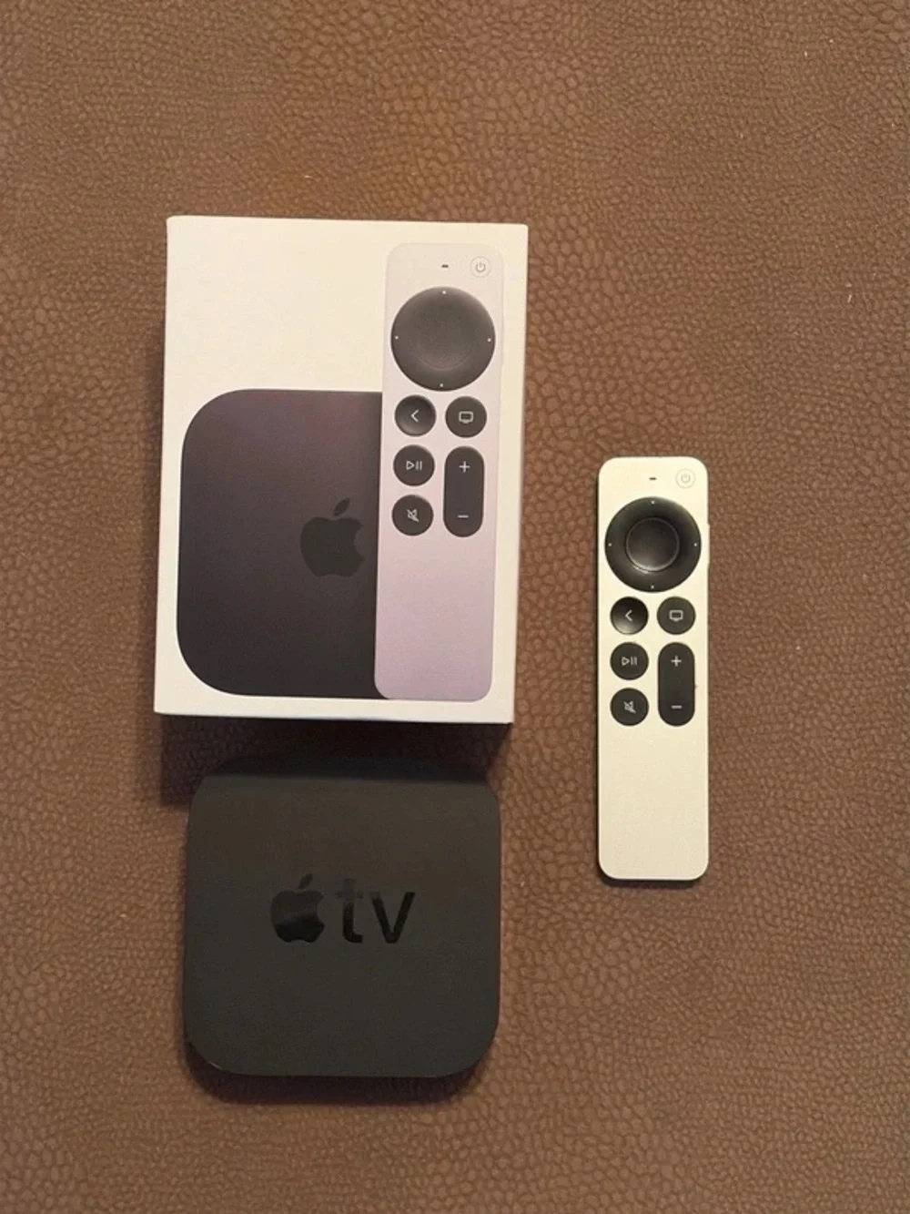 Apple TV 4K 1st Gen streaming box with White and Black Siri Remote
